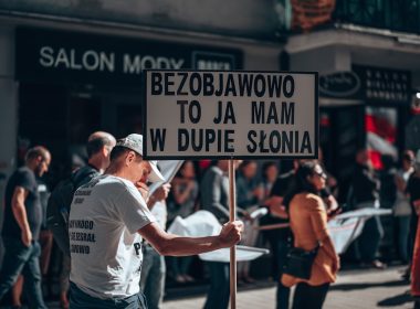 a man holding a sign