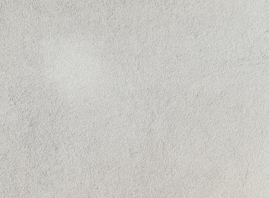 a close up of a white stucco wall