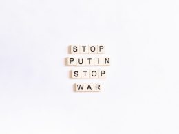 scrabble tiles spelling stop, puttin, stop, war