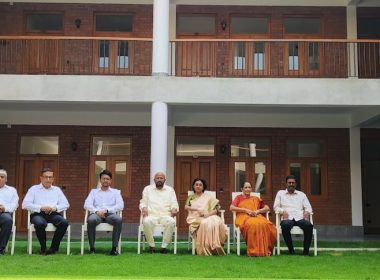 a group of people sitting outside a building