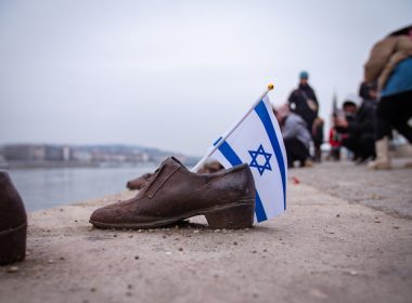 a pair of shoes with a flag sticking out of them