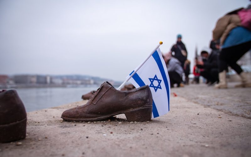 a pair of shoes with a flag sticking out of them