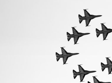 a group of fighter jets flying in formation