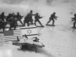 Toy soldiers, flags, and jet on map