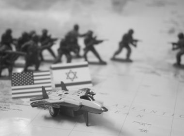 Toy soldiers, flags, and jet on map